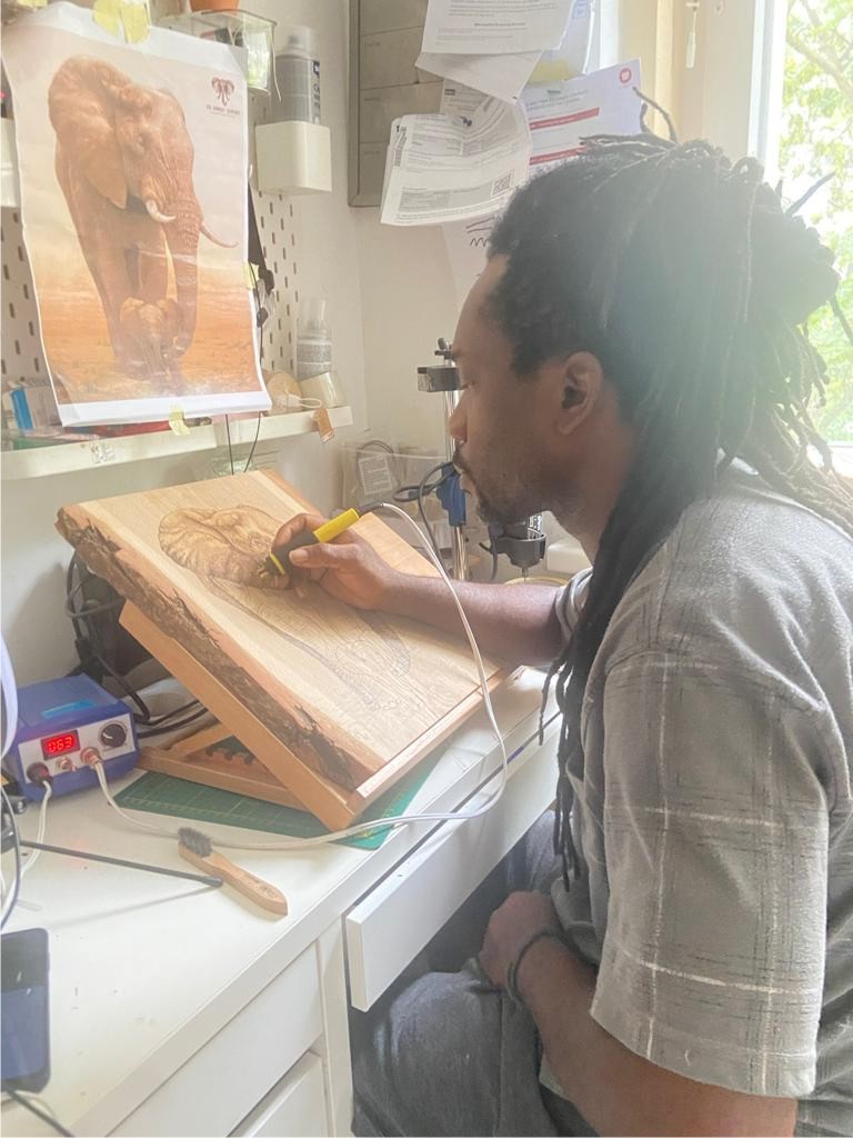 Artist-kingsley-onwumelu-african-art-pyrographic-wood-burning-artist-in-Zürich-Bern-Geneva-Lausannevienna-Austria